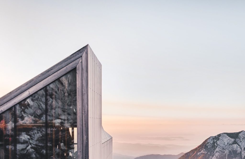 Sunset light over a timber-clad building