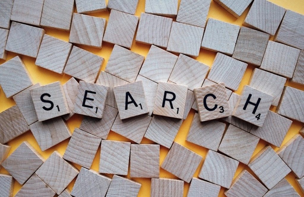 Wooden alphabet pieces spelling SEARCH