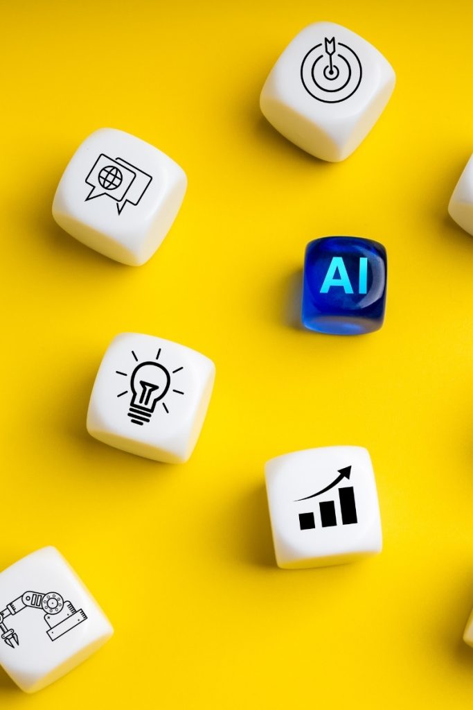 Dice on a yellow surface show AI, search, and analytics symbols for Trumbull